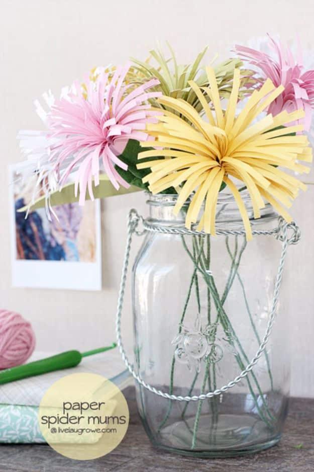 DIY paper spider mums, pink and yellow fringed paper spider mums arranged in a large clear glass jar