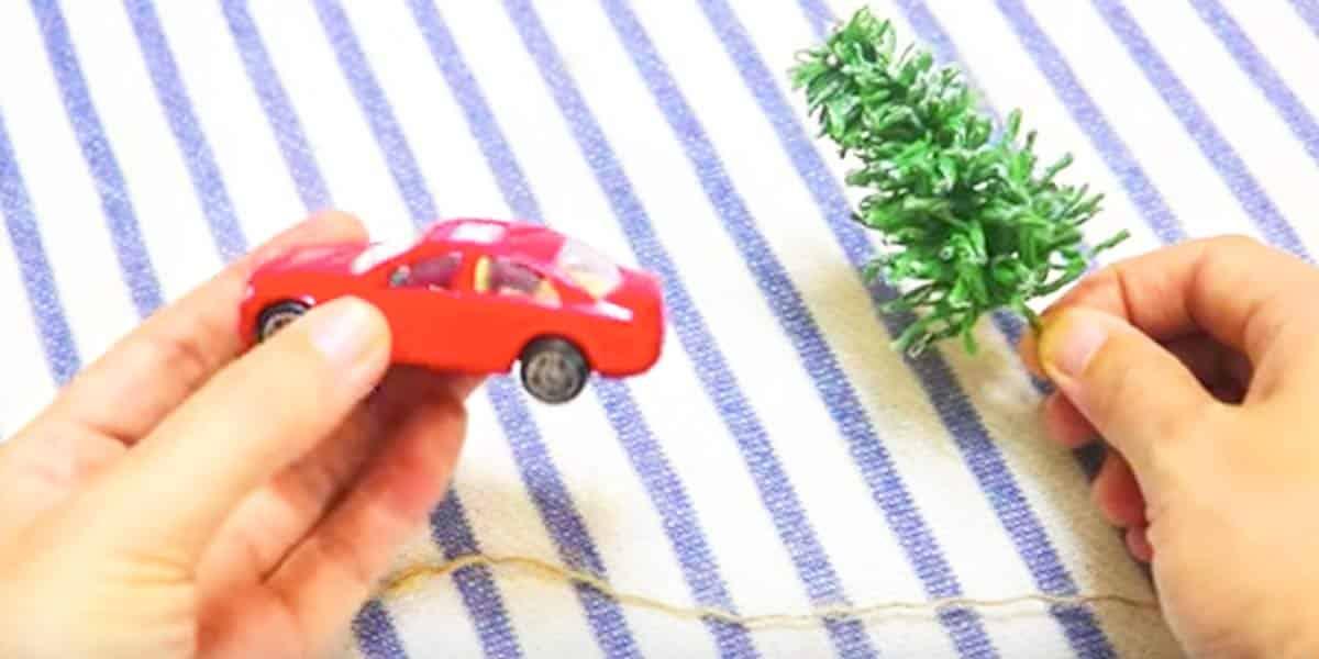 Watch The Clever Thing She Does With This Little Red Car And Christmas Tree!