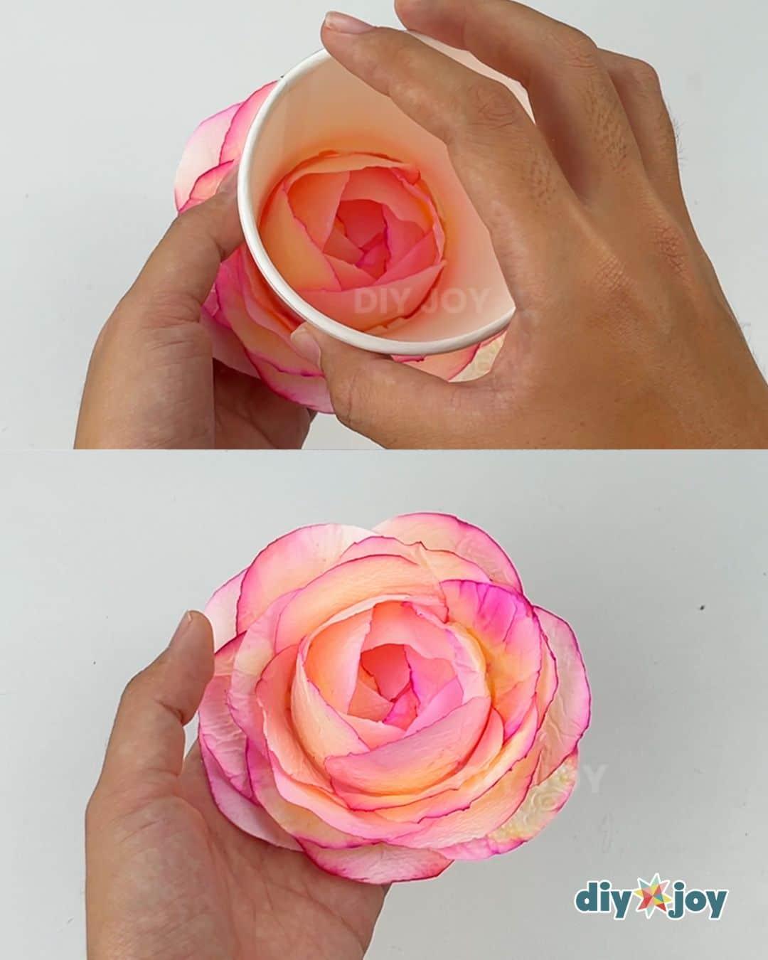 Removing the finished paper rose from the paper cup mold, the last handmade toilet paper flower craft step