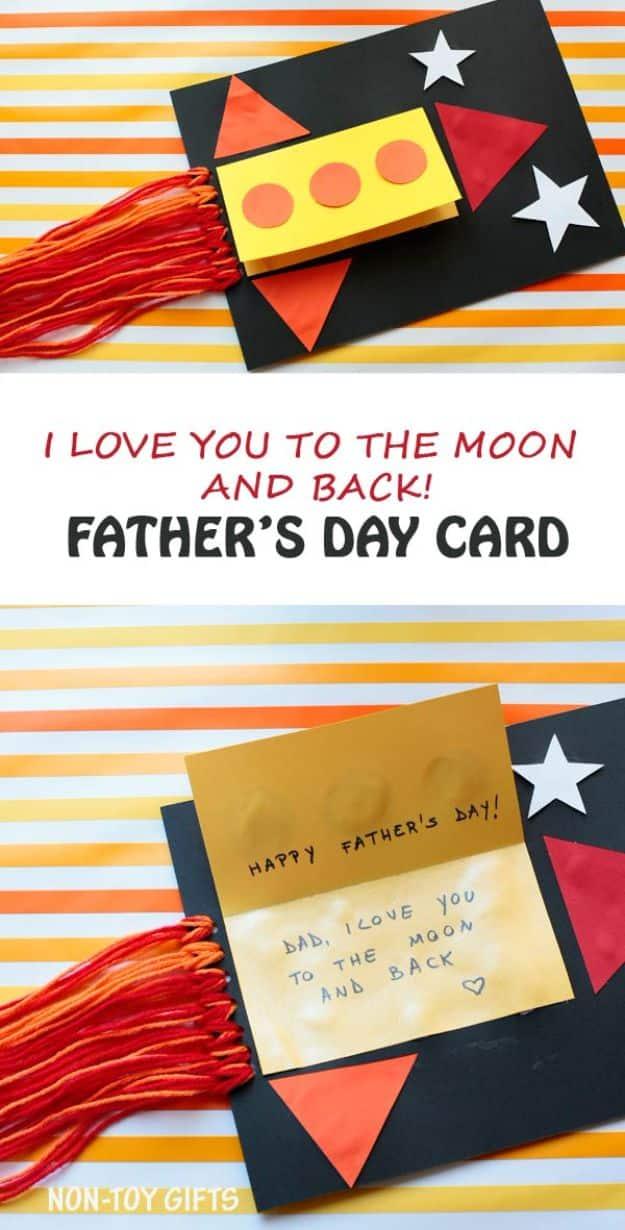 Rocket Father's Day card graphic, a paper rocket on black card with red and orange yarn flames and the message