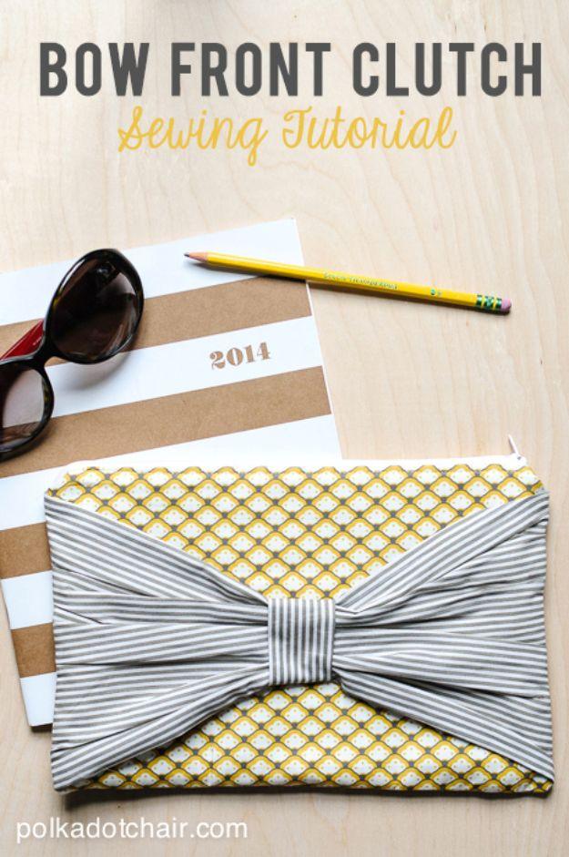 Bow front clutch in a yellow scallop print with a wide gray ticking stripe bow, styled with sunglasses