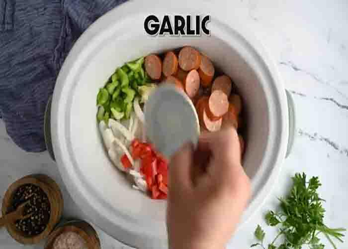 Placing all the jambalaya ingredients to the slow cooker