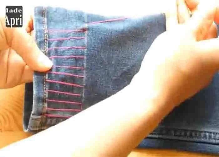 Stitching the bottom of the jeans to shorten it