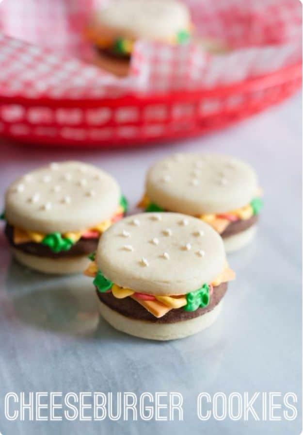 Cheeseburger cookies made from stacked vanilla and chocolate cookies with orange fondant cheese slices