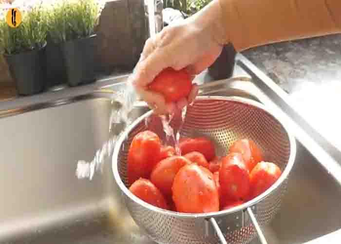 Washing the tomatoes thoroughly