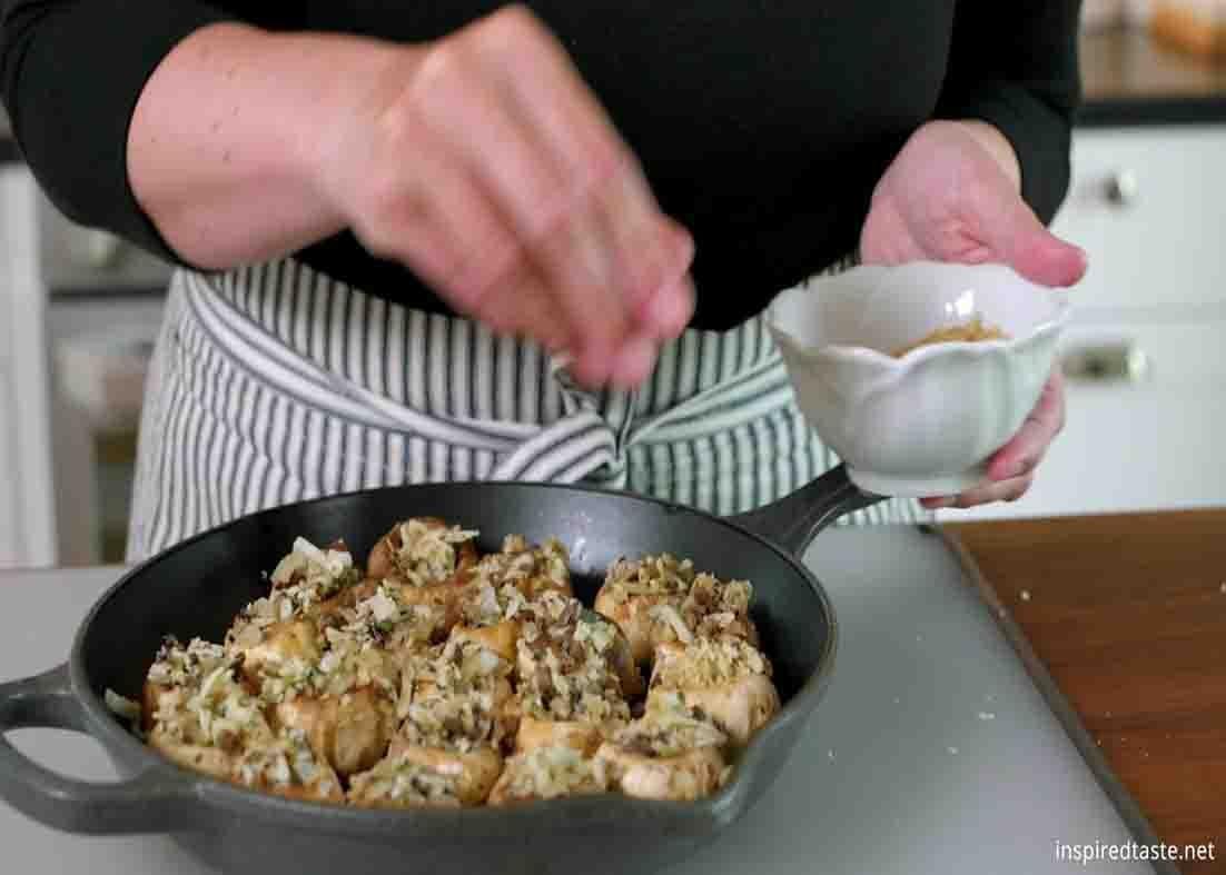 Seasoning the mushrooms with salt and pepper
