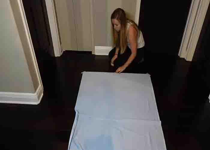 Taping the background down to the working area