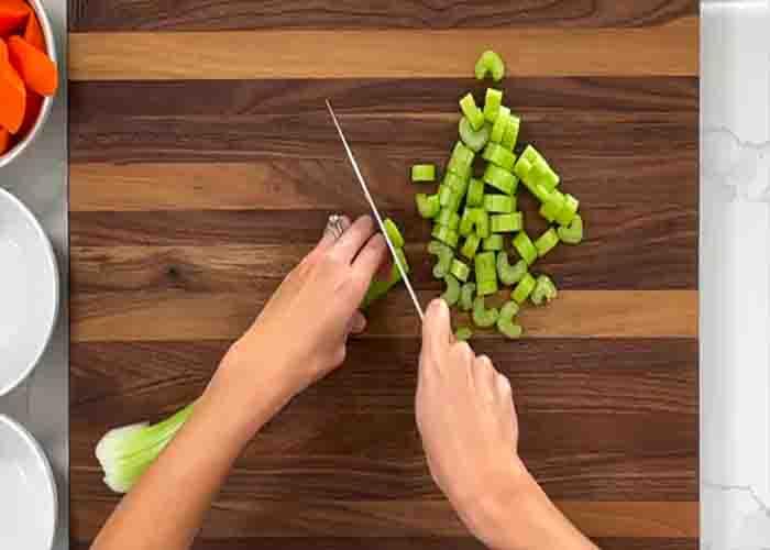 Chopping the celery for the classic beef stew recipe