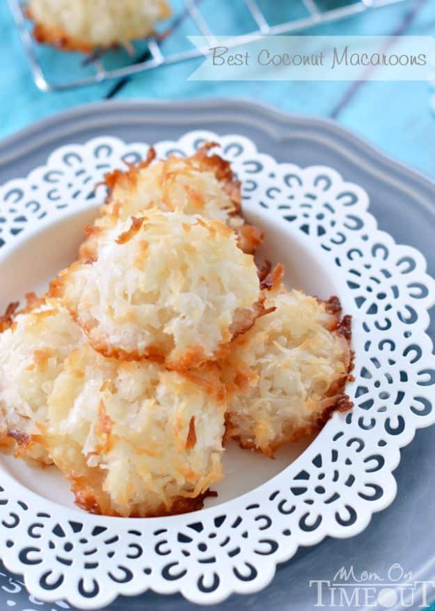 Graphic reading Best Coconut Macaroons above golden toasted coconut macaroons on a white doily plate
