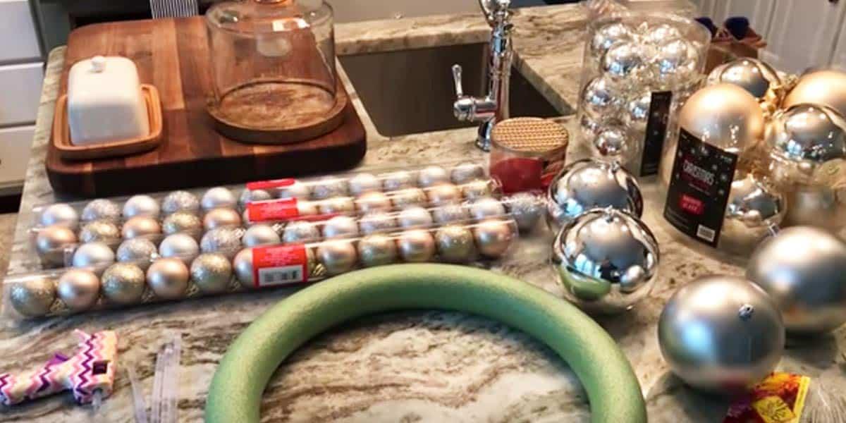 She Makes This Incredible Wreath For $8 With Dollar Store Ornaments. Watch!