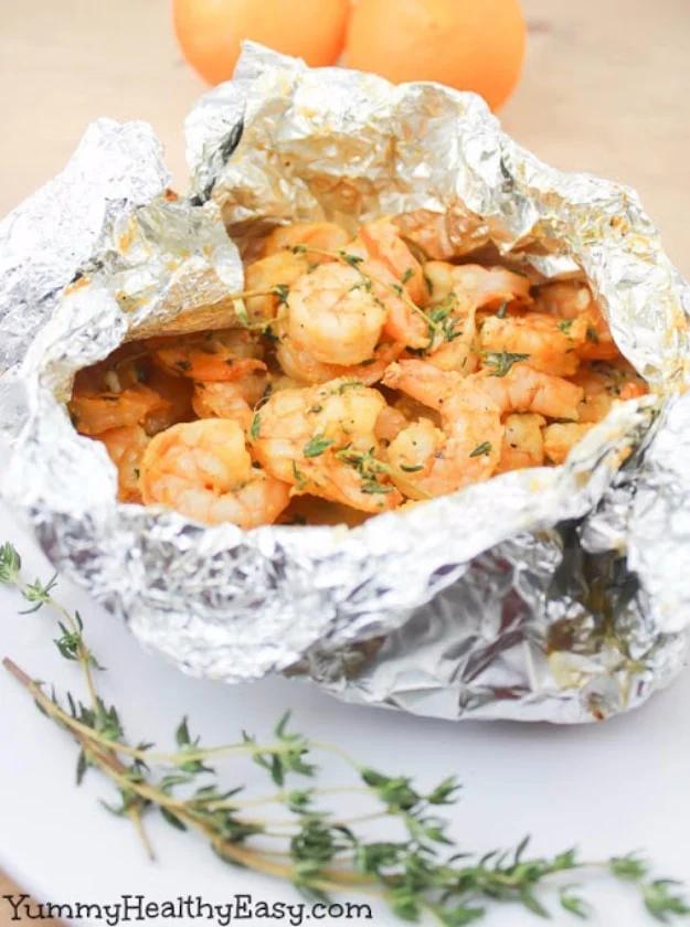 Orange thyme shrimp foil packets grilled outdoors instead of turning on the oven all summer long for the whole family