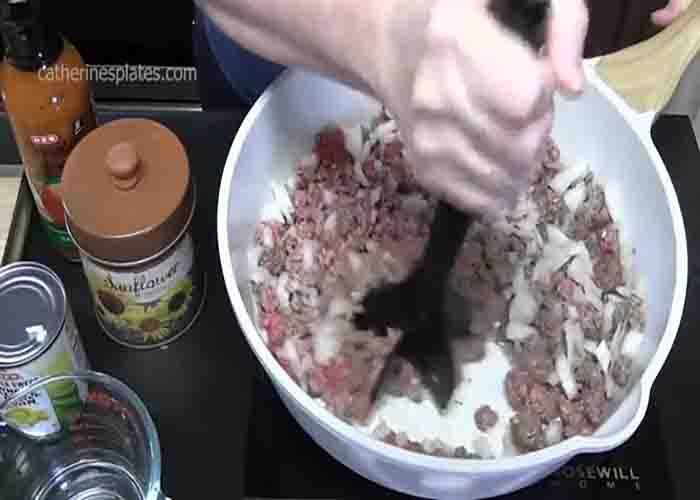 Making the ground beef layer of the Doritos taco salad