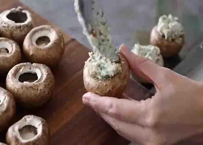 Filling the mushroom before baking