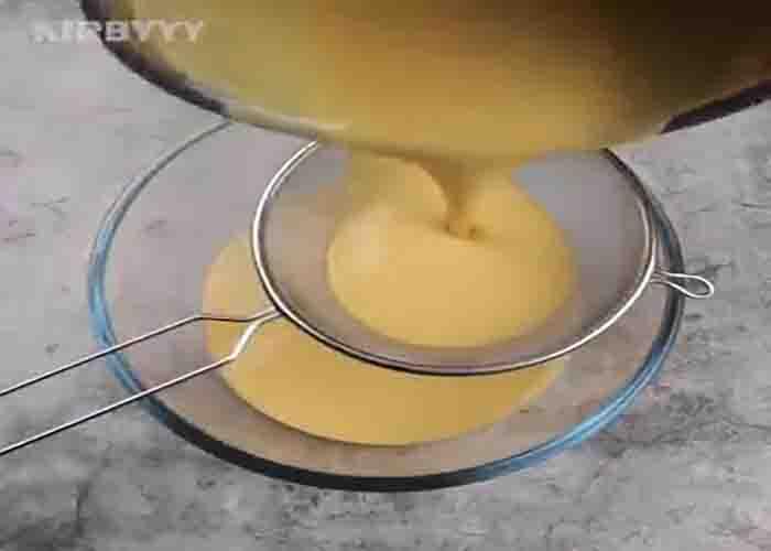 Sifting the flan for the cupcake recipe