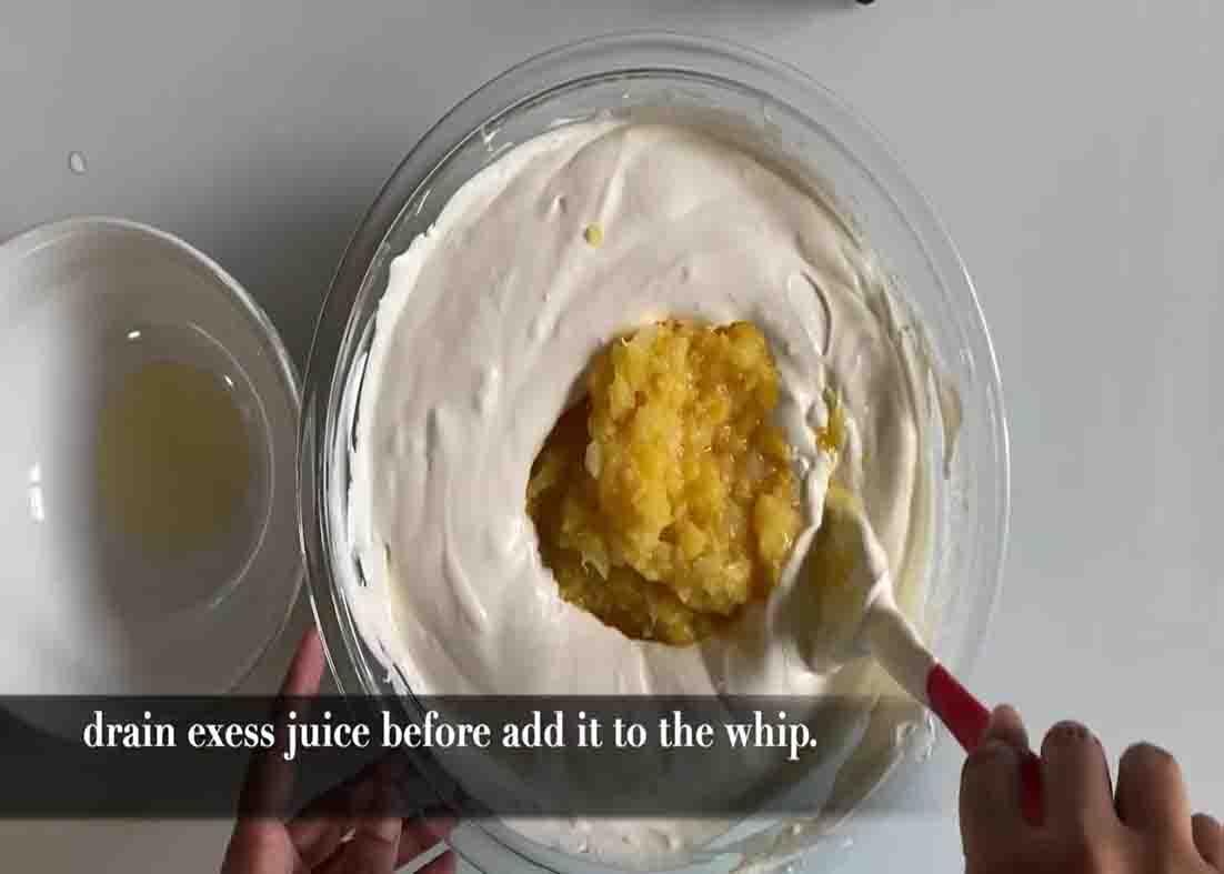 Mixing the ingredients for the pineapple whip dessert recipe