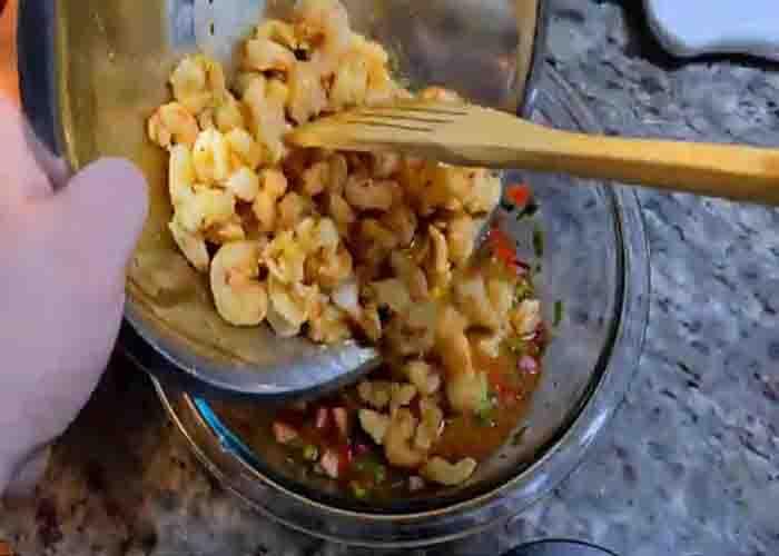 Tossing the Mexican shrimp cocktail recipe