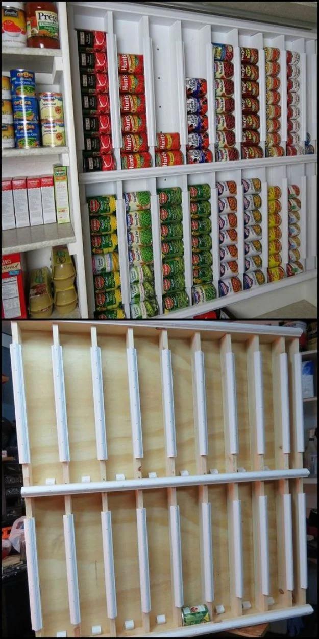 Rotating canned food shelves packed with soup and vegetable cans, plus the plywood rack frame mid build