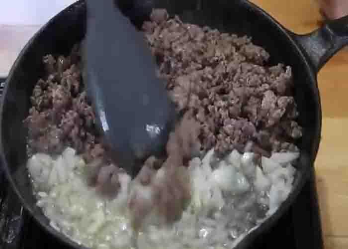 Cooking the ground beef for the shipwreck skillet