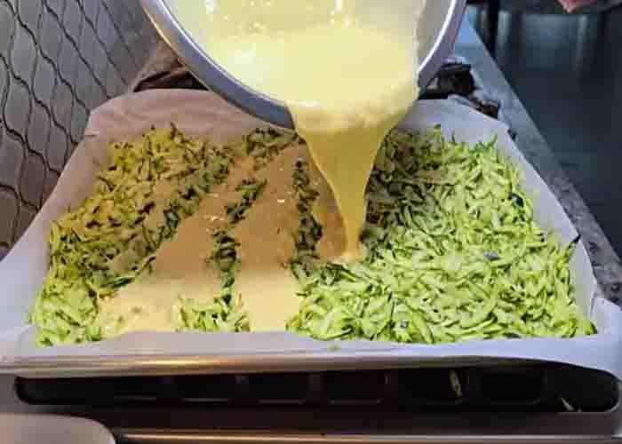Assembling the sheet pan zucchini casserole