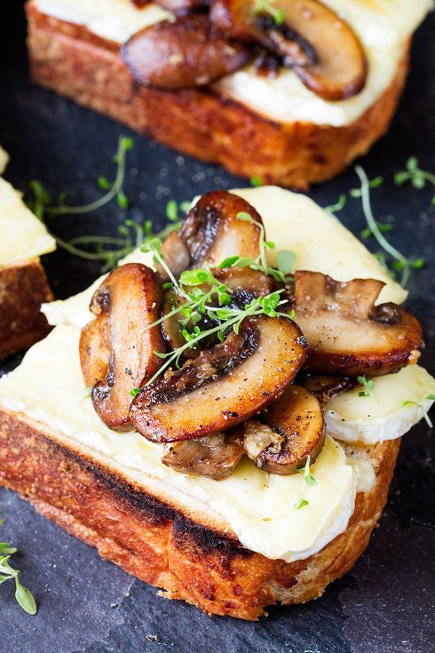 Garlic mushroom and brie toast, browned garlic mushrooms and melted brie on toasted bread with fresh thyme