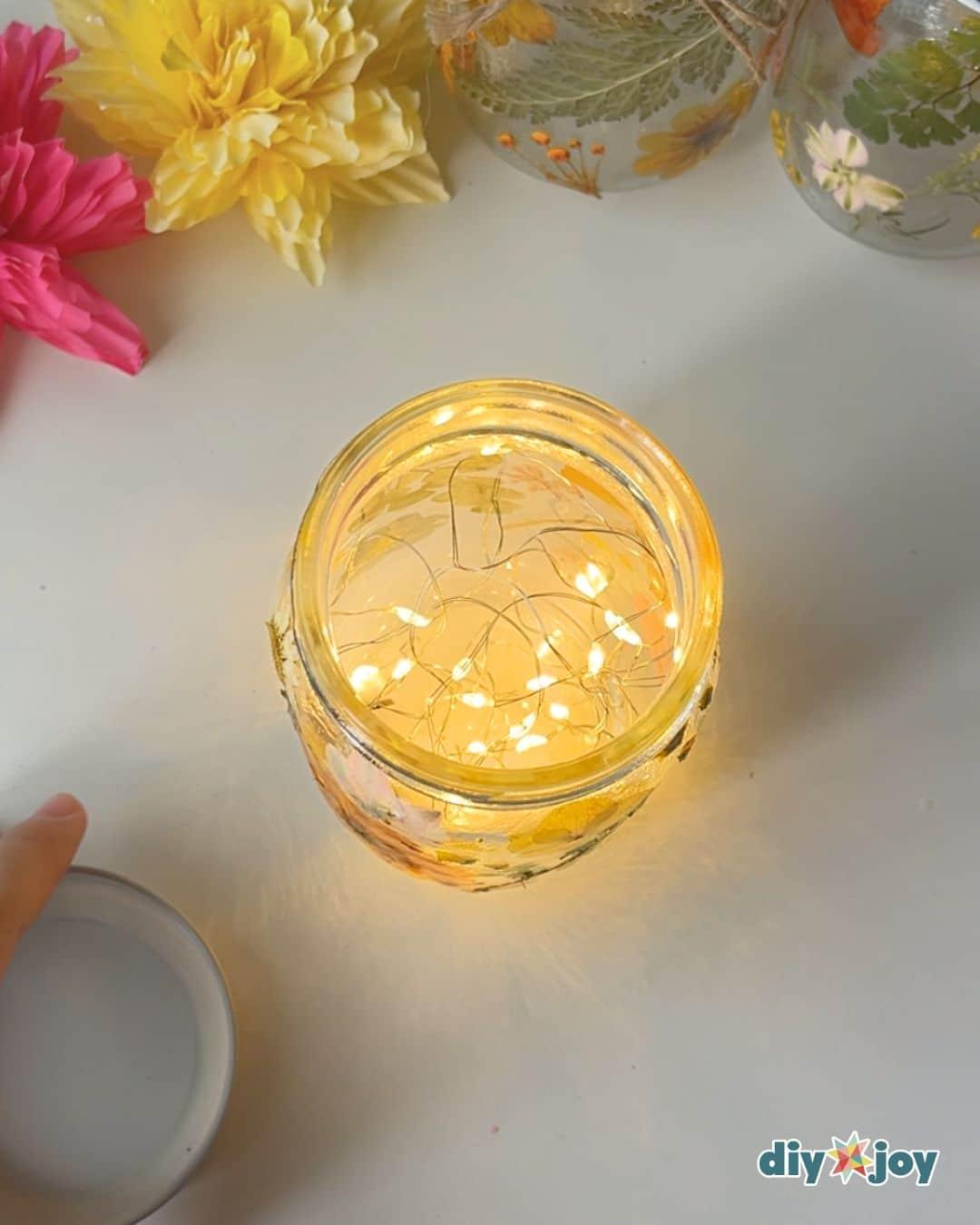 Mason Jar Fairy Lights Pressed Flowers — adding the fairy lights