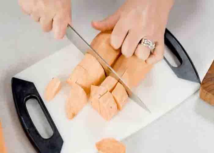 Chopping the sweet potatoes for the casserole recipe
