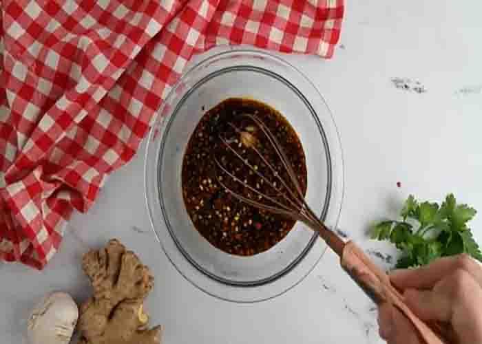 Making the sauce for the honey garlic meatballs