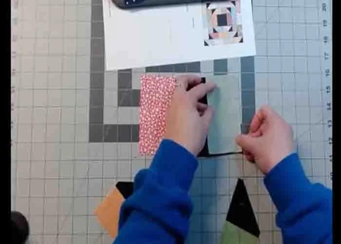 Sewing the fabric pieces to make the folded corners quilt block