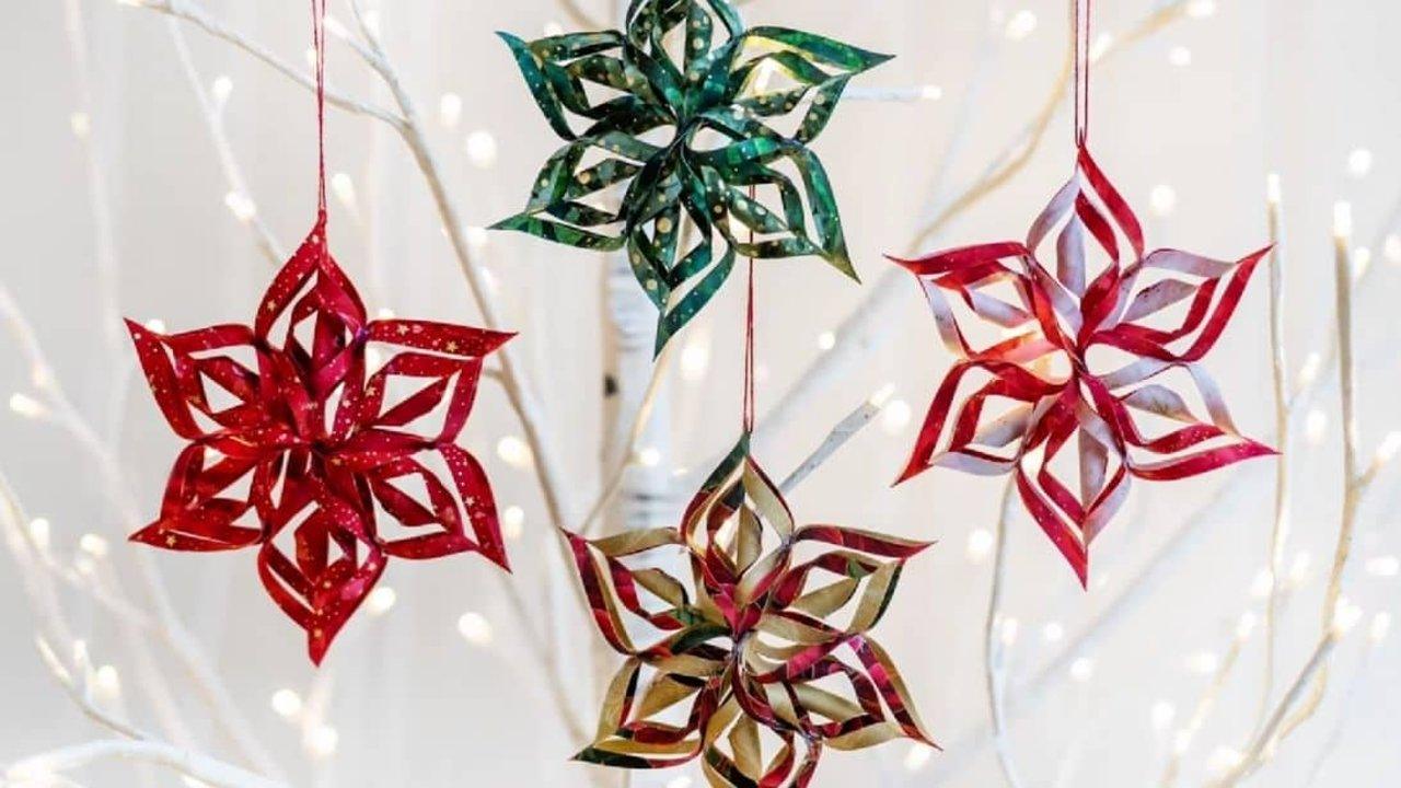 Three dimensional fabric snowflake made from two patterned fabrics, folded and glued with no sewing at all
