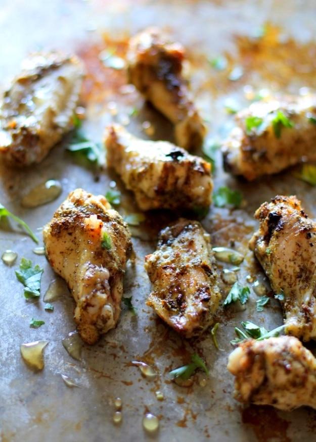 Baked chicken wings with herbs and a honey drizzle on a sheet pan, an easy 3 ingredient party recipe