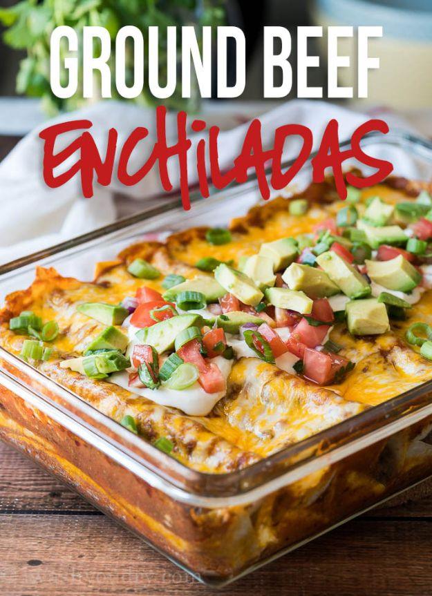 Ground beef enchiladas rolled in flour tortillas under red enchilada sauce and melted marbled cheddar