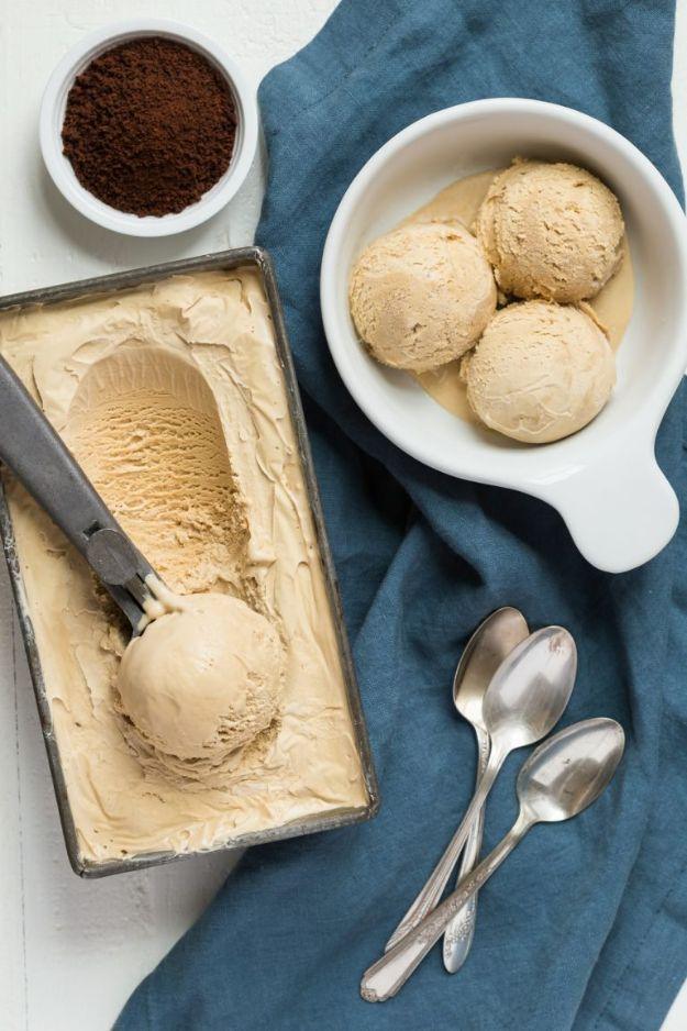 Homemade coffee ice cream in a loaf pan with a scoop taken out, a rich custard based frozen dessert recipe