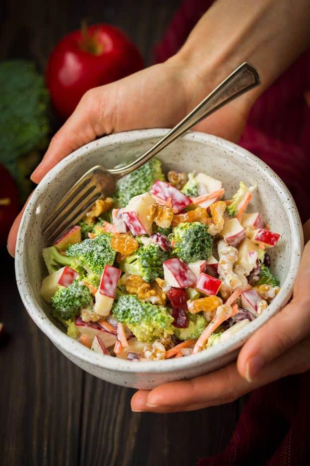 Broccoli apple salad with raw florets, diced gala apples, walnuts and matchstick carrots in a creamy dressing