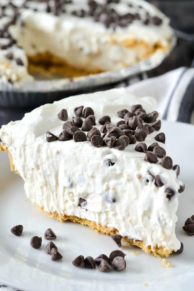 No bake cannoli cream pie with ricotta filling, mini chocolate chips and whipped cream in a crust, an easy no bake dessert