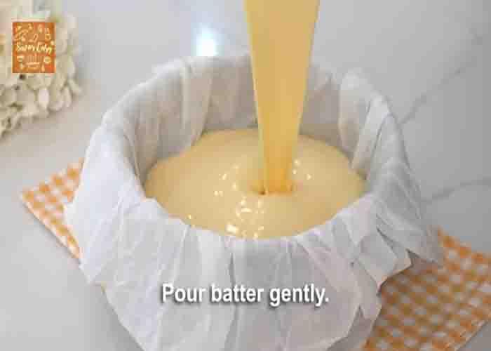 Pouring the basque cheesecake batter into the cake mold