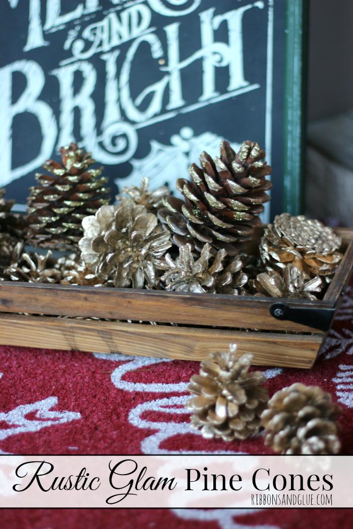 Pine cones coated in gold glitter and metallic gold paint piled in a basket as rustic glam Christmas porch decor