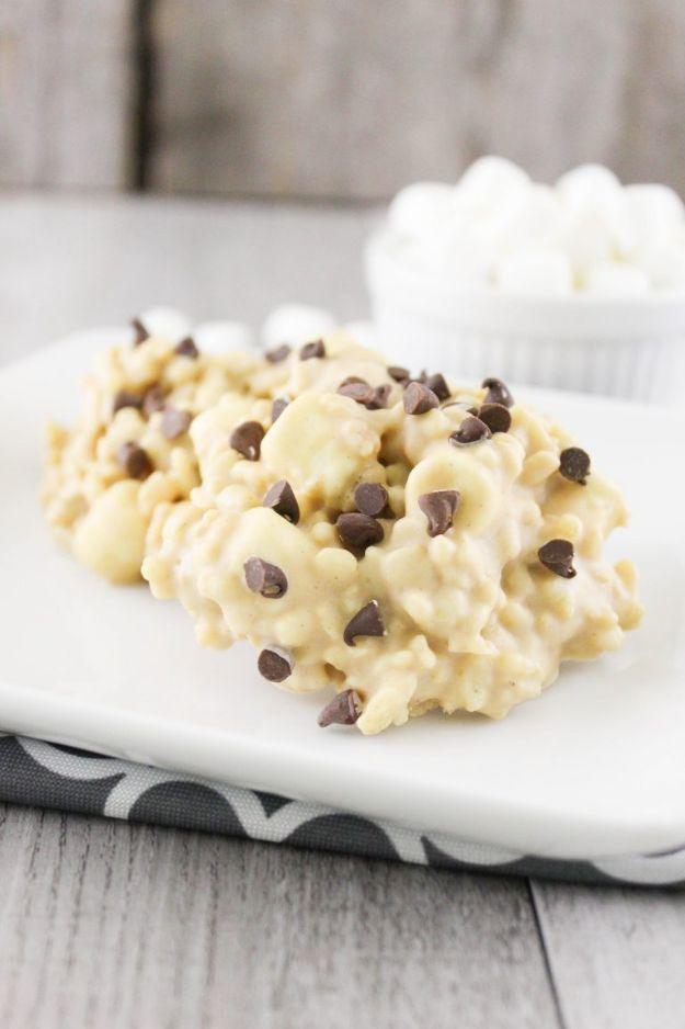No bake avalanche cookies made with Rice Krispies, marshmallows and white chocolate on parchment, an easy no bake dessert