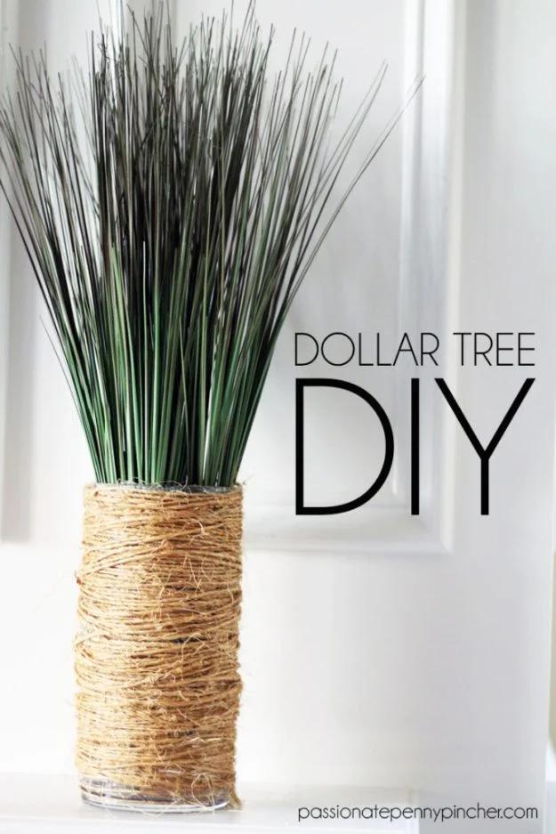 Dollar Tree DIY graphic with a glass vase wrapped in twine holding tall green grass on a white surface