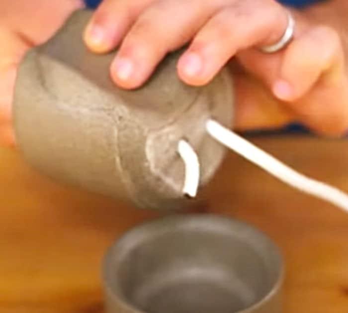 Drill holes in the bottom of a planter and use a wick to make a hydroponic self watering planter