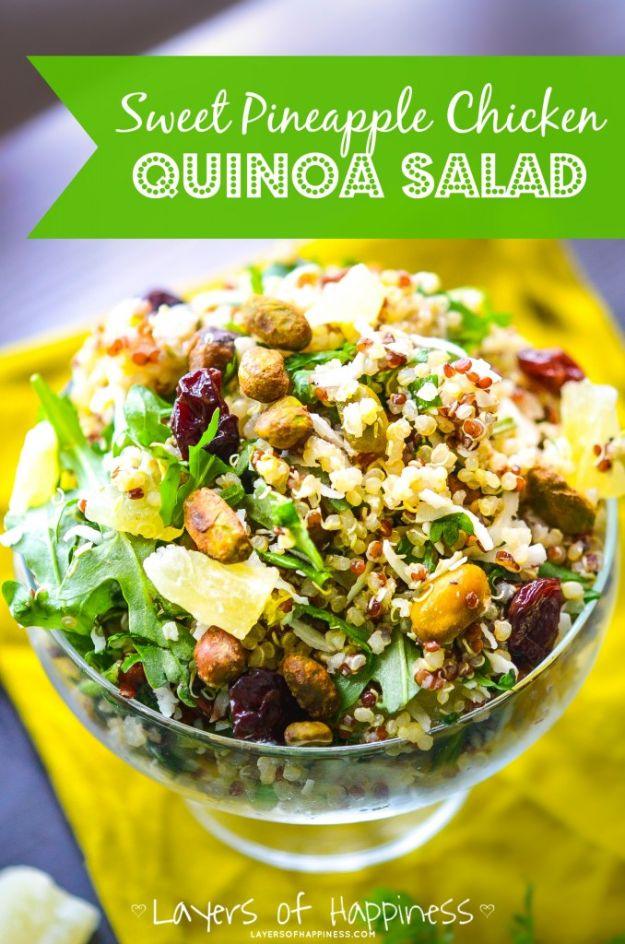 Sweet pineapple chicken quinoa salad with arugula, pistachios, dried cherries and flaked coconut in a bowl