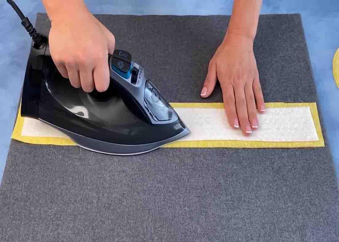 Pressing the wadding and the canvas fabric together
