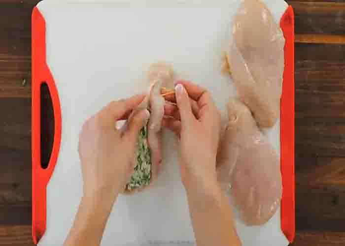 Stuffing the chicken breasts with spinach and cream cheese