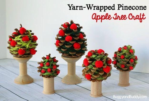 Handmade apple project, paper or fabric craft inspiration featuring the finished yarn-wrapped pinecone apple tree craft