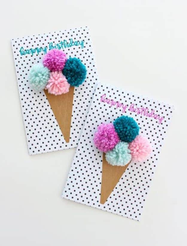 An ice cream scoop card topped with a fluffy pom pom for a textured playful birthday design for the whole family