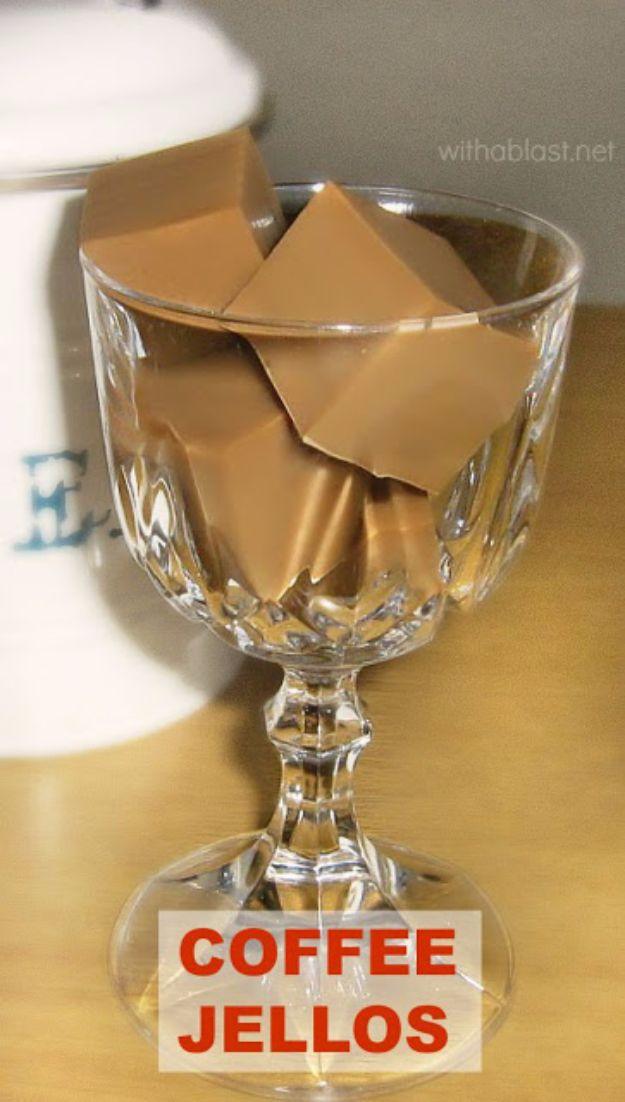 Coffee jellos, neatly cut cubes of pale tan coffee jelly piled high in a tall cut glass goblet on a wooden table