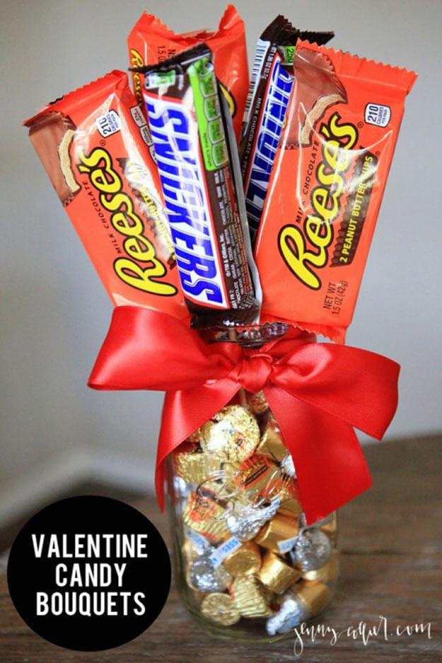 Candy on skewers arranged like a flower bouquet inside a mason jar for a Valentine's Day gift idea for February 14