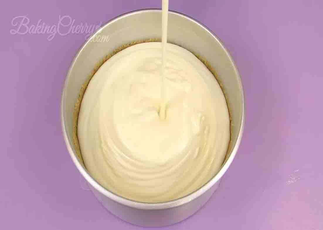 Pouring the lemon mousse pie mixture to the baking pan
