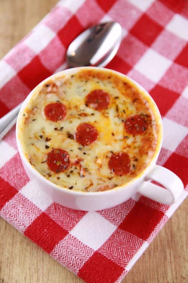 Microwave mug pizza with melted mozzarella and mini pepperoni in a mug, an easy one minute kid snack