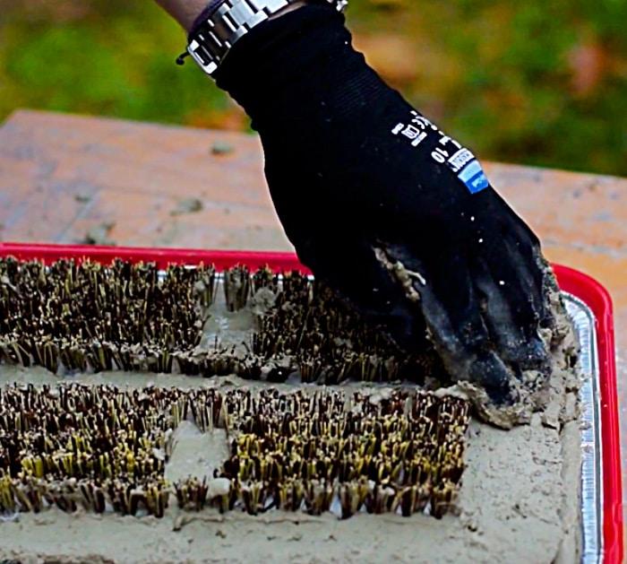 Learn to make a DIY cement boot brush mat for the doorway