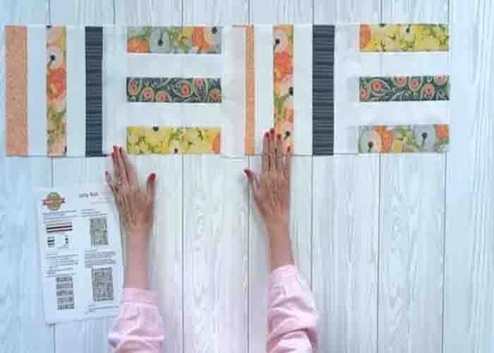 Arranging the blocks to complete the jelly roll relish quilt top
